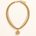 Tiny Crown Necklace — Studio view