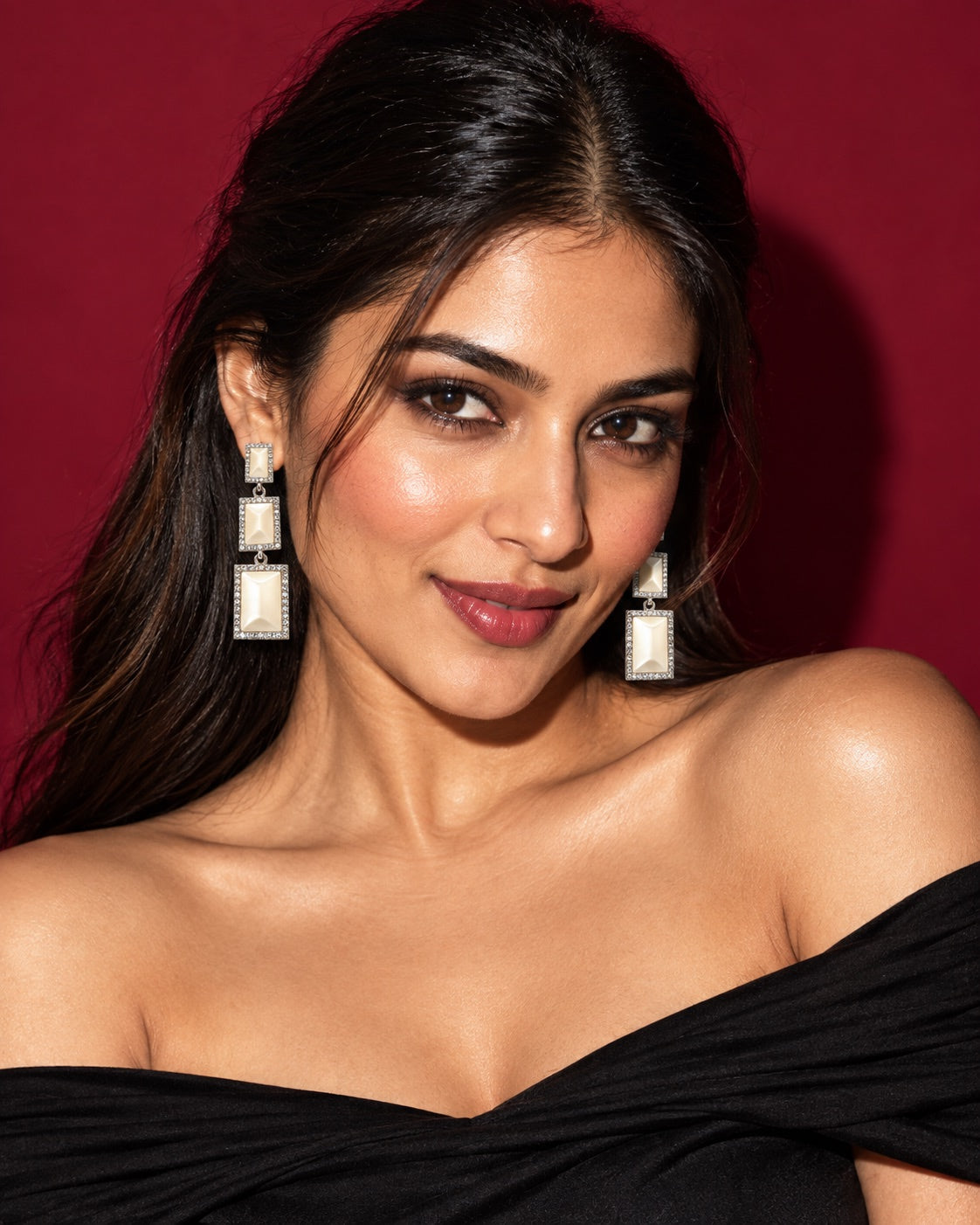 Evening styling with a black top and Ivory Glow drop earrings against Cherry